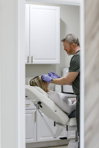 Dr. Amason works on a patient in his med spa in the Jacksonville, FL Area